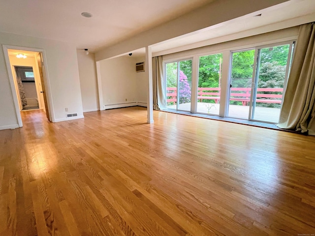 25 Old Middle Rd, Brookfield, CT 06804 - spare room featuring light wood-style floors, a wall mounted AC, baseboard heating, and baseboards