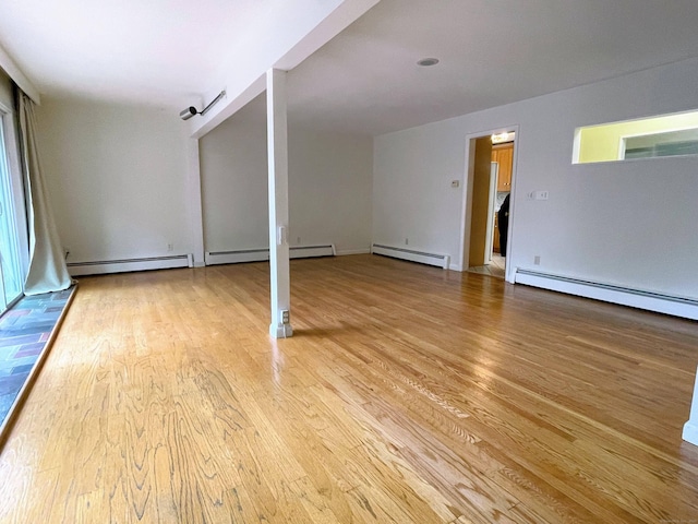 25 Old Middle Rd, Brookfield, CT 06804 - unfurnished living room featuring a baseboard heating unit and light wood finished floors
