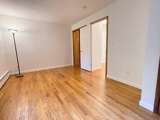 25 Old Middle Rd, Brookfield, CT 06804 - unfurnished bedroom featuring light wood finished floors, baseboards, and baseboard heating