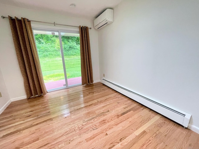 25 Old Middle Rd, Brookfield, CT 06804 - spare room with baseboard heating, a wall mounted air conditioner, light wood-style flooring, baseboards, and a smoke detector