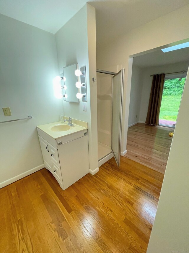 25 Old Middle Rd, Brookfield, CT 06804 - bathroom with vanity, a stall shower, wood finished floors, and baseboards