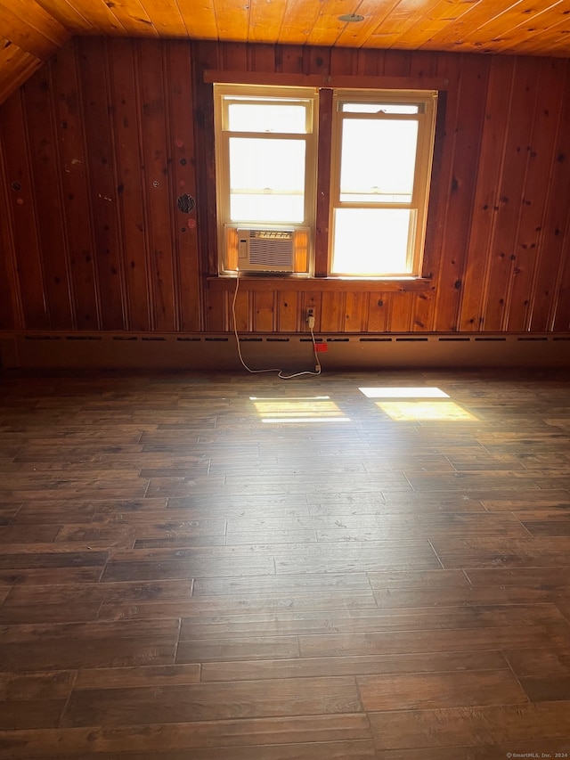 empty room with dark wood-type flooring, wood ceiling, and lofted ceiling