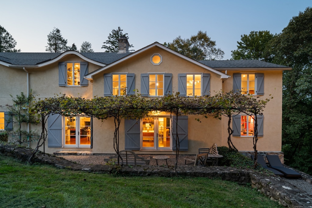 rear view of house with a lawn