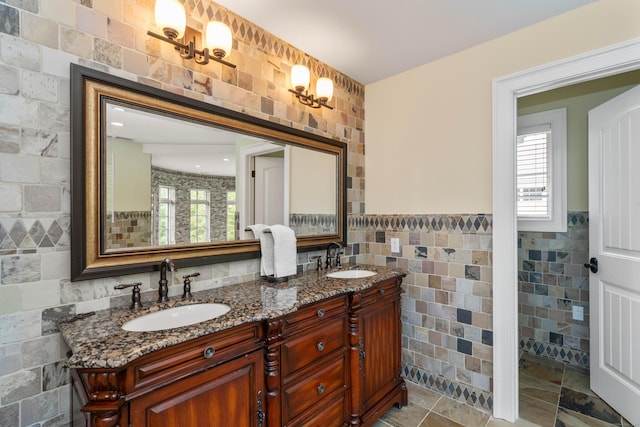 162 Balfour Dr, West Hartford, CT 06117 - full bath with tile walls, double vanity, and wainscoting