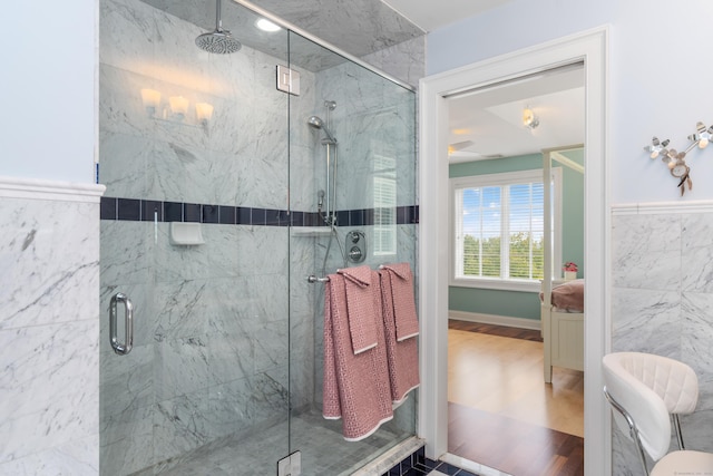 162 Balfour Dr, West Hartford, CT 06117 - bathroom with a marble finish shower, ceiling fan, and wood finished floors