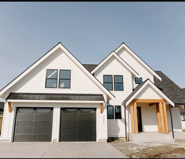 modern farmhouse featuring a garage