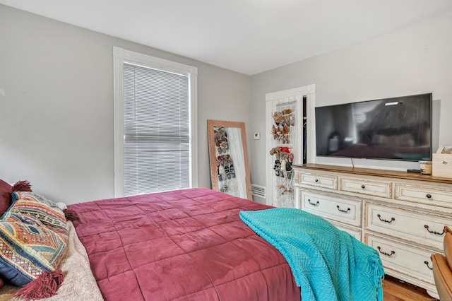 bedroom with hardwood / wood-style floors