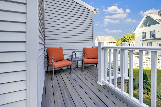 deck featuring a lawn