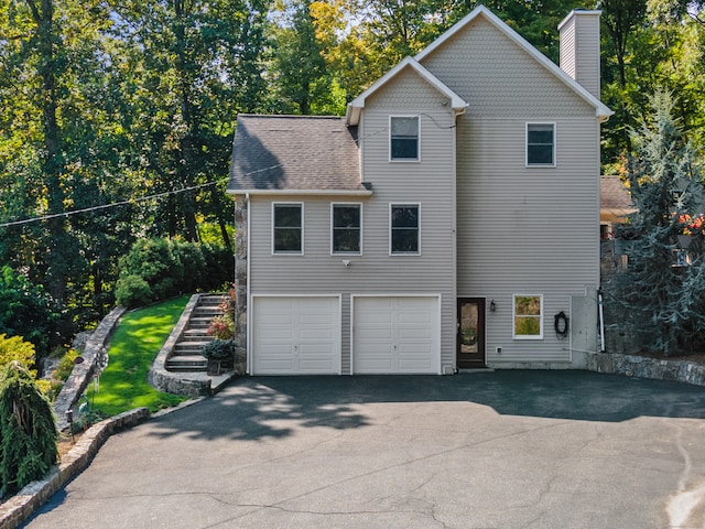 view of side of home featuring a garage