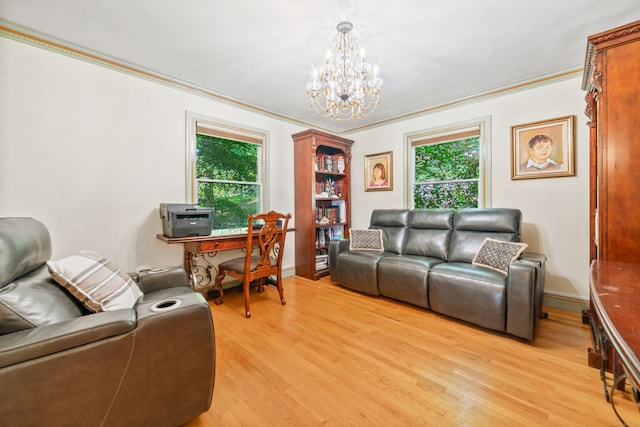 living room featuring a notable chandelier, light hardwood / wood-style flooring, and ornamental molding