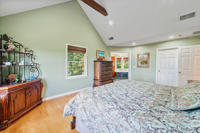 bedroom featuring ceiling fan, light hardwood / wood-style flooring, a closet, and high vaulted ceiling