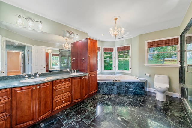 bathroom with double vanity, a notable chandelier, a sink, and a garden tub
