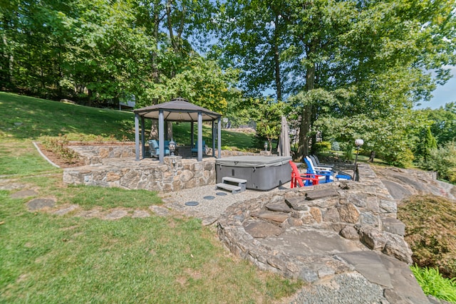 view of yard with a gazebo, a patio, and a hot tub