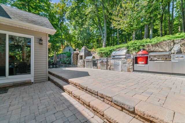 view of patio / terrace featuring a grill and exterior kitchen