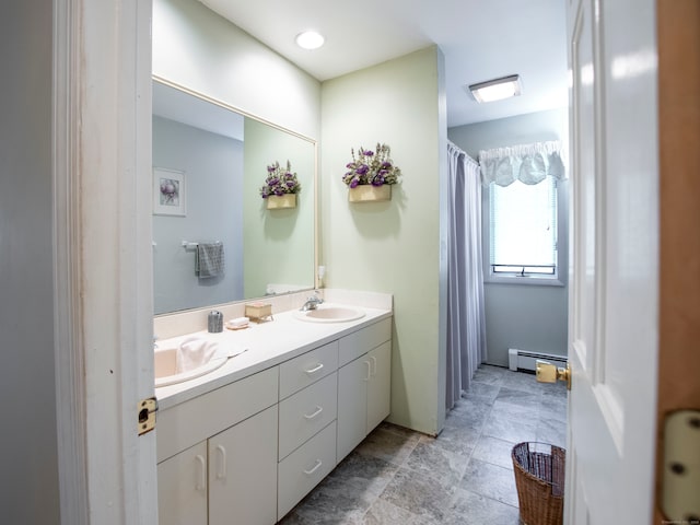 bathroom featuring vanity and a baseboard heating unit