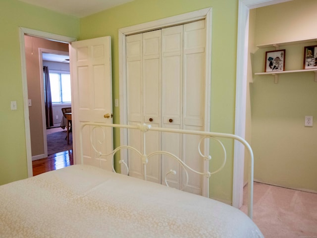 carpeted bedroom with a closet