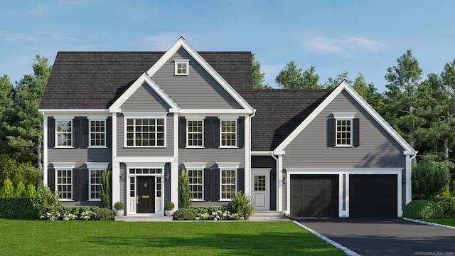 view of front of home with a front yard and a garage