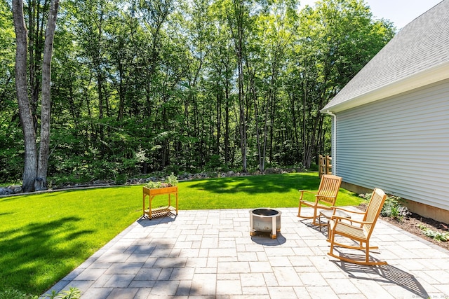 view of patio / terrace featuring an outdoor fire pit