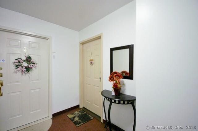 entrance foyer featuring baseboards