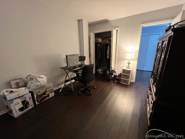 office with dark wood-style flooring