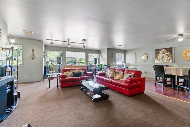 living room with ceiling fan and carpet floors