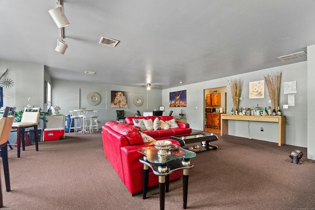 carpeted living room with bar and ceiling fan