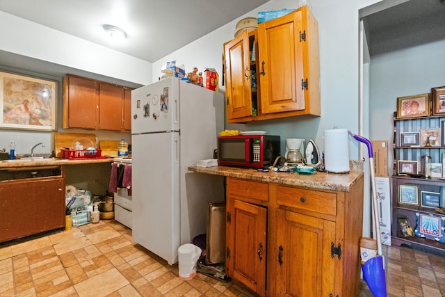 kitchen featuring sink and black appliances