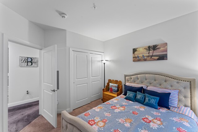 bedroom featuring a closet and carpet