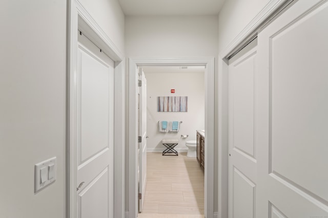 hall with light hardwood / wood-style floors