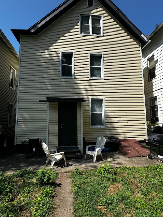 rear view of property featuring a patio