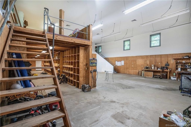 garage featuring wood walls