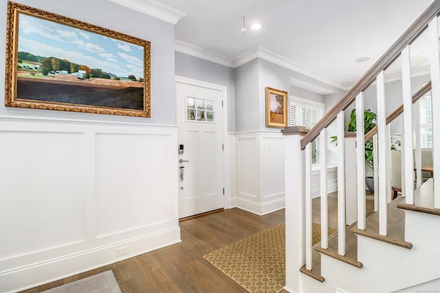 entryway featuring crown molding and dark hardwood / wood-style floors