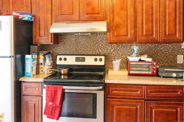 kitchen featuring stainless steel appliances and backsplash