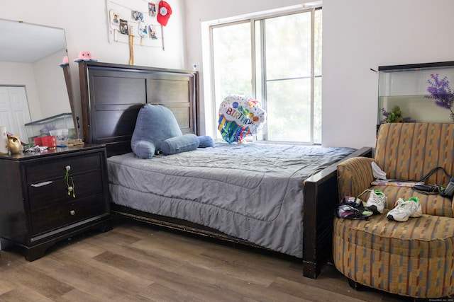 bedroom with wood-type flooring