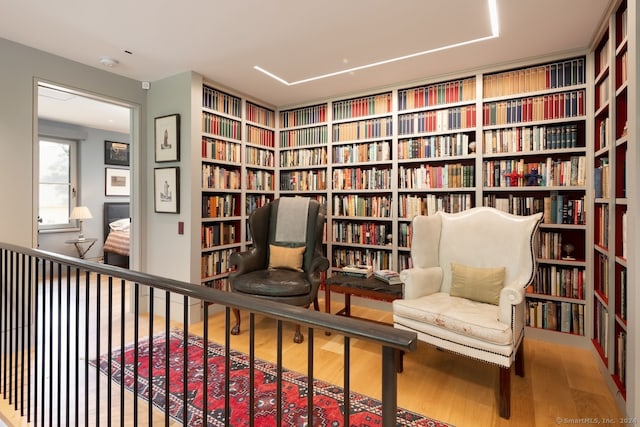 sitting room featuring hardwood / wood-style floors