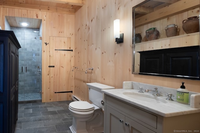 bathroom with walk in shower, toilet, wooden walls, and vanity