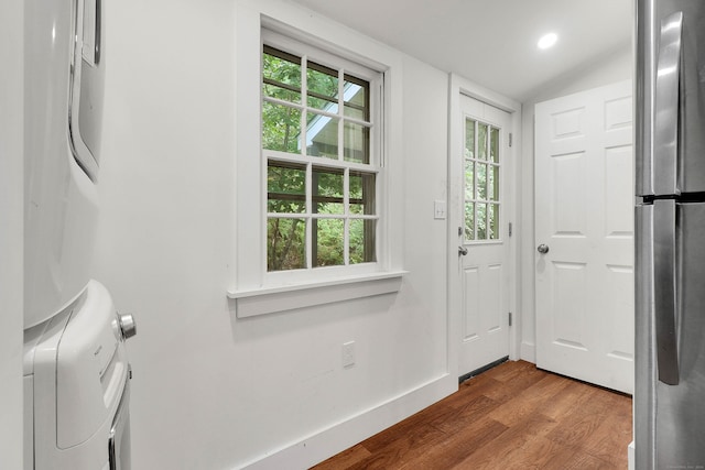 entryway featuring lofted ceiling and dark hardwood / wood-style floors