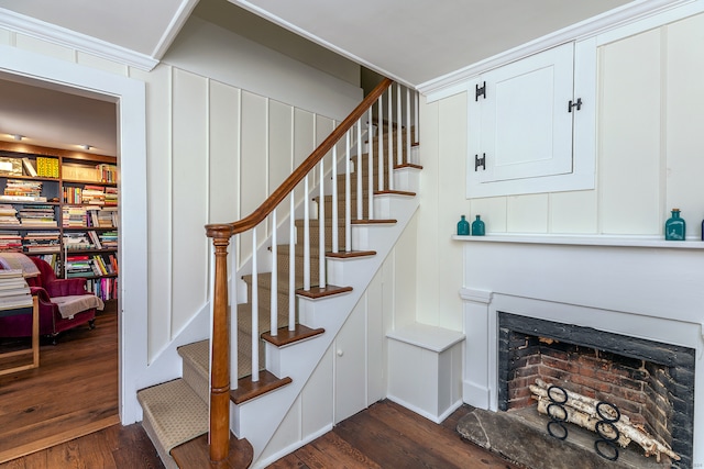 staircase with hardwood / wood-style floors