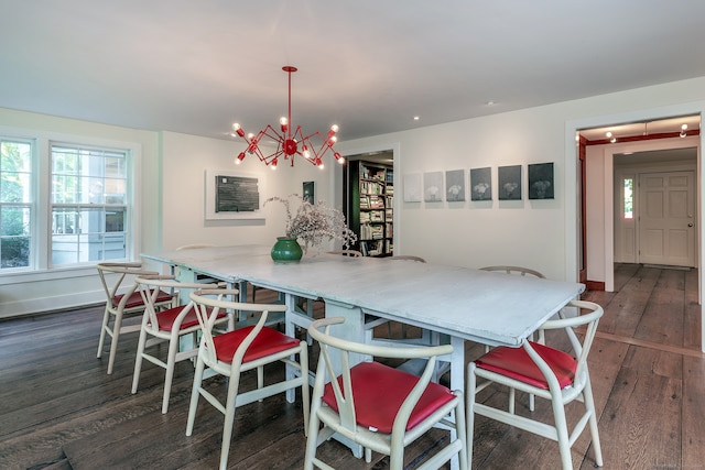 dining room featuring an inviting chandelier and dark hardwood / wood-style flooring