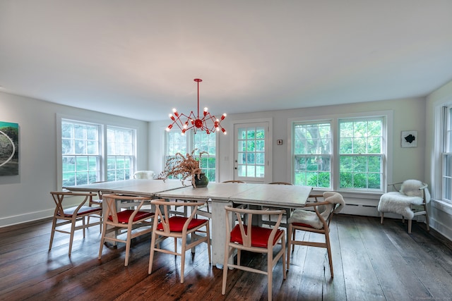 dining room featuring an inviting chandelier and dark hardwood / wood-style flooring