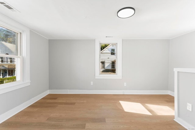 unfurnished room with light hardwood / wood-style flooring