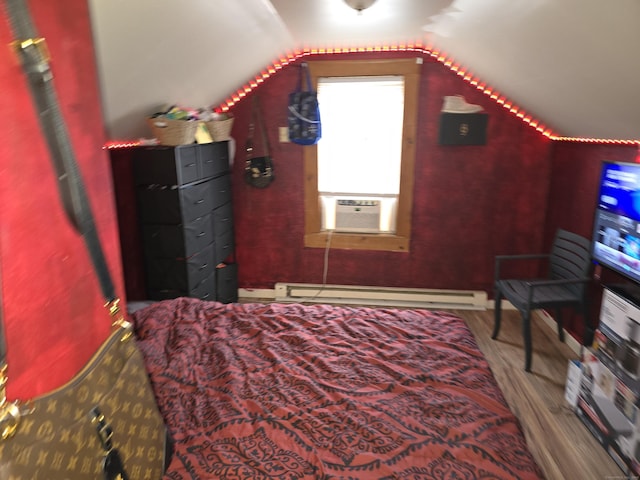 218 Oak Ave, Torrington, CT 06790 - bedroom with lofted ceiling, cooling unit, a baseboard radiator, and wood finished floors