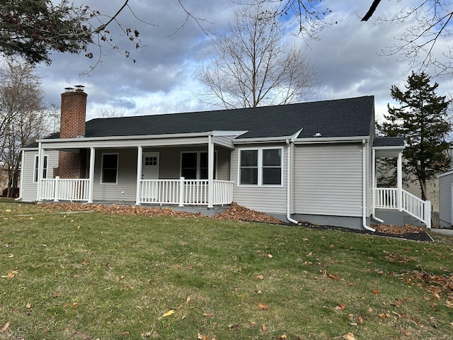 view of front of home with a porch and a front lawn