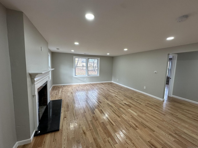 unfurnished living room featuring light hardwood / wood-style flooring