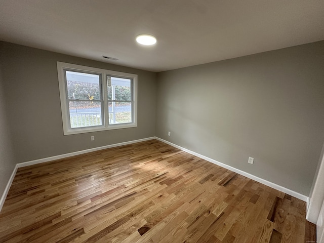 spare room with light wood-type flooring