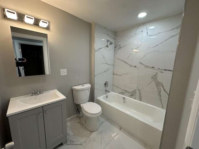 full bathroom featuring vanity, toilet, and tiled shower / bath