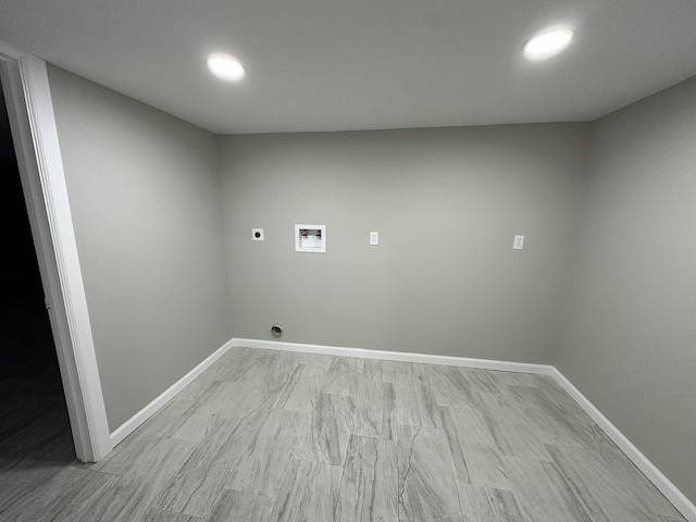 washroom featuring electric dryer hookup, washer hookup, and light wood-type flooring