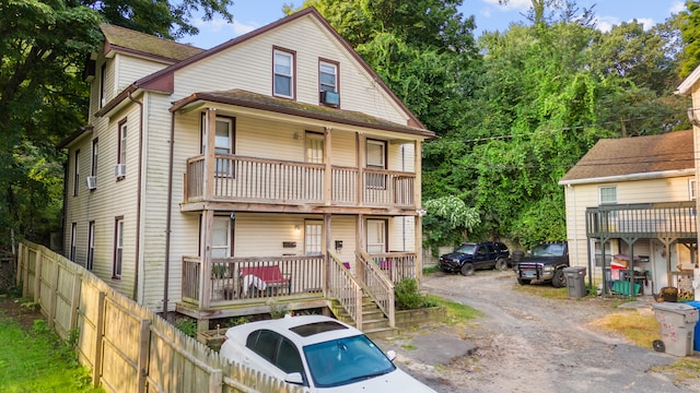 back of house with a balcony