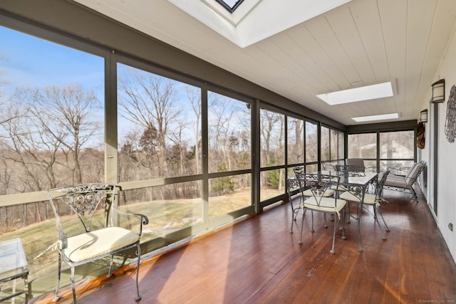 sunroom with a skylight and plenty of natural light