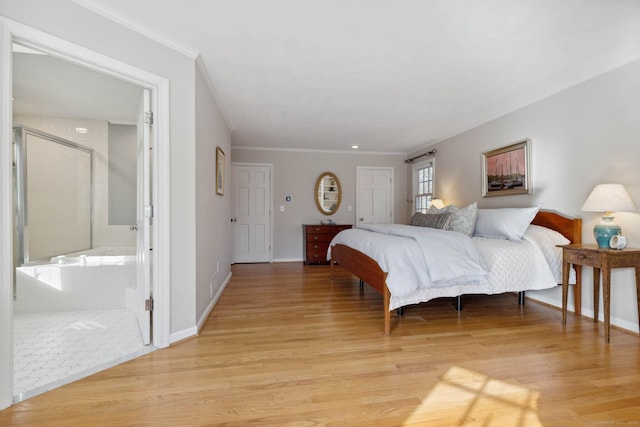 bedroom featuring ensuite bath, crown molding, and light wood-type flooring